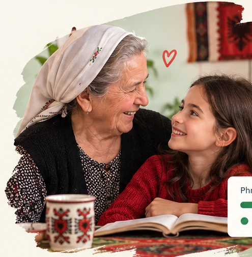 A grandmother sharing an Albanian language-learning moment with her granddaughter